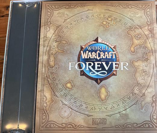 A book cover with a circular design, including the text "WORLD WARCRAFT FOREVER" and "BLIZZARD ENTERPRISES" at the bottom. The cover is mostly beige with gold accents.