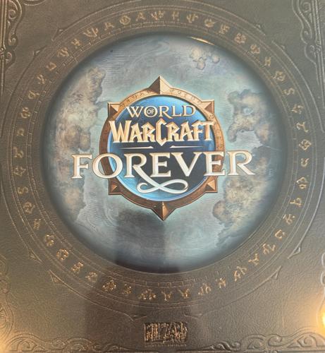 A gold-colored card with a circular blue and white design. The text "WORLD WARCRAFT FOREVER" is visible in the center.